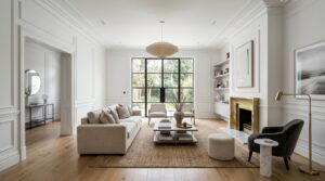 A sophisticated, wide-angle interior shot of a modern, minimalist living room featuring clean white
