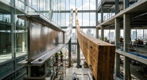 A high-end editorial shot featuring a clean architectural aesthetic, with a polished steel beam and